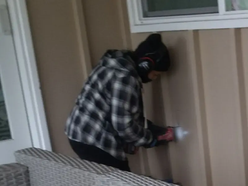 Professional electrician installing an exterior outlet in Parma