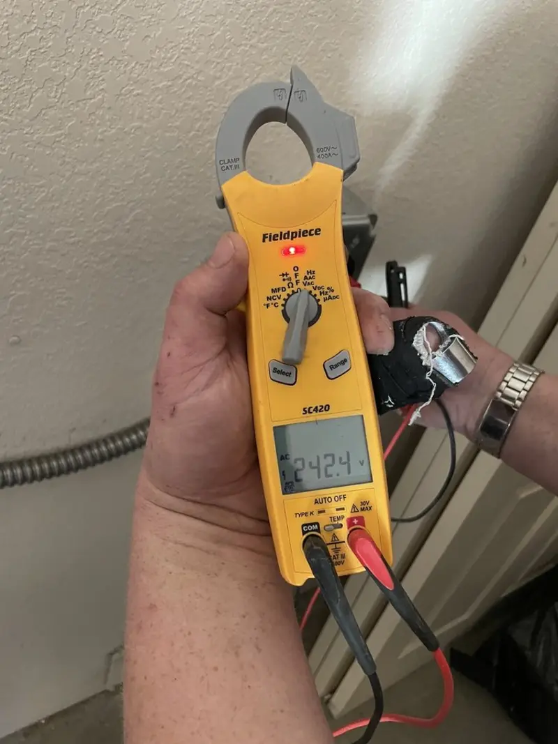 Voltage testing with clamp meter during Aluminum Wiring Replacement in Parma